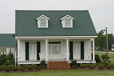 white exterior ranch house with green metal roof|white metal roof interior ideas.